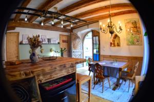 a kitchen and dining room with a table and chairs at Chaud'Vin in Kaysersberg +37 photos