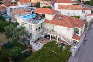 an aerial view of a house with a swimming pool at Apartments Sweet Dreams in Trebinje