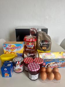 a group of food items sitting on top of a table at Chambre privée dans un appartement partagé in Villeurbanne +7 photos