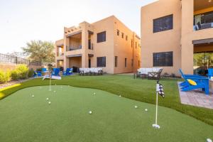 a resort with a putting green with golf balls on it at Residence 1- The Villas At Troon North Golf Club townhouse in Scottsdale