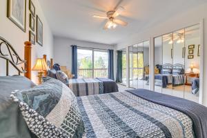 a bedroom with two beds and a ceiling fan at New York Retreat - Furnished Deck and Mountain Views in Lanesville