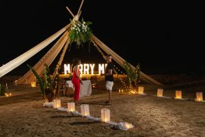 a man and a woman standing in front of a tent at ANGKLA Beach Club & Boutique Resort in El Nido +46 photos