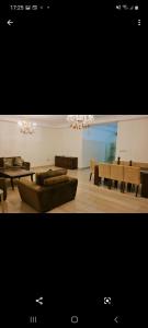 a living room with a couch and a table at Luxry apartment in Abdoun. Amman, jordan in Amman