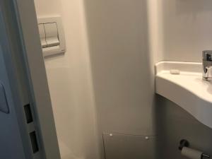 a small bathroom with a sink and a toilet at Moulin Authentique avec Pêche, Animaux Acceptés et Confort Moderne près du Mans - FR-1-410-323 in Mézières-sur-Ponthouin +13 photos