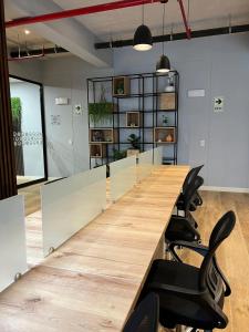 a large conference room with a long table and chairs at Aparment Deluxe San Isidro in Lima +38 photos