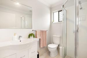 a bathroom with a toilet and a sink and a shower at Air-Con, Netflix, Close to Transport & Private in Brisbane
