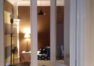 a view of a room with a bed through a window at Casa hotel Mi Huila in Neiva