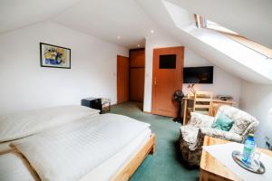 a bedroom with a bed and a desk and a chair at Pelikan in Aleksandrów Łódzki +40 photos