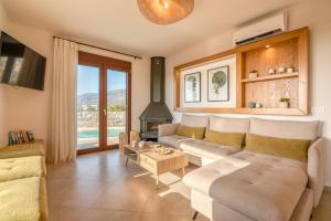 a living room with a couch and a fireplace at Sia Elafonisi Pool House in Elafonisi