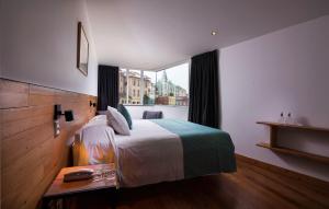 Postel nebo postele na pokoji v ubytování Fauna Hotel