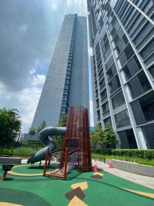 a playground in front of a tall building at Millerz Square Mid Valley, Old Klang Road in Kuala Lumpur