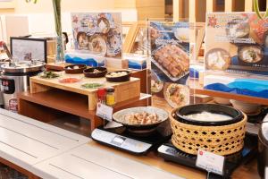 a display of food on a table in a store at Vessel Hotel Ishigakijima in Ishigaki Island