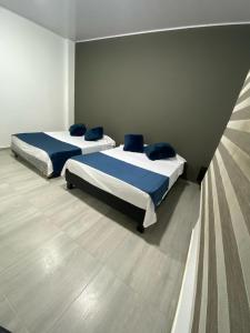 Postel nebo postele na pokoji v ubytování La Bonita Restrepo Meta