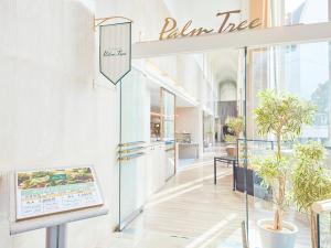a store front with a sign that reads palma tree at Rembrandt Hotel Tokyo-Machida in Machida