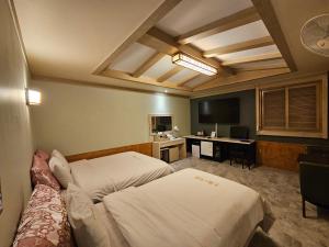 Postel nebo postele na pokoji v ubytování Hotel G7 Daejeon