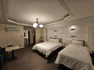 Postel nebo postele na pokoji v ubytování Hotel G7 Daejeon