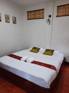 Ein Bett oder Betten in einem Zimmer der Unterkunft Hotel Pailifornia
