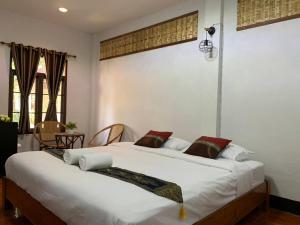 Ein Bett oder Betten in einem Zimmer der Unterkunft Hotel Pailifornia