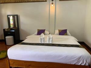 Ein Bett oder Betten in einem Zimmer der Unterkunft Hotel Pailifornia