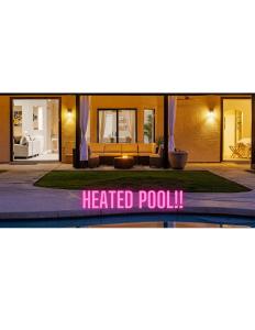 a sign that reads heated pool in front of a house at King Bed - High End -Westgate Villa. in Avondale