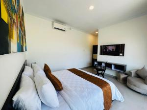 Giường trong phòng chung tại Maliqa Villas Nusa Penida