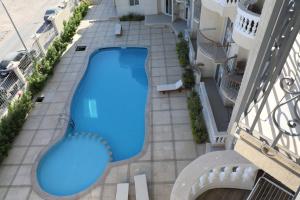 an overhead view of a swimming pool in a building at Private sea view Penthouse New apartment Pool and Jacuzzi in Montazah in Sharm El Sheikh