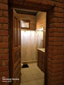 een open deur naar een badkamer met een douche bij Los Cipreses-10persons-Deep connection with nature 