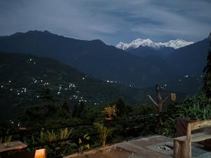 a view of a mountain range with snow capped mountains at Mochilero Ostello in Pelling