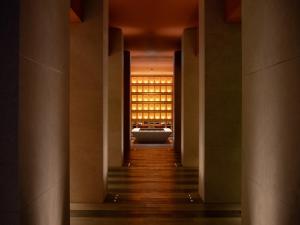a hallway leading to a building with aasteryasteryasteryasteryasteryasteryasteryastery at Hotel Il Palazzo in Fukuoka +57 photos
