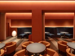 a rendering of a restaurant with tables and chairs at Hotel Il Palazzo in Fukuoka