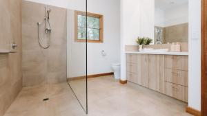 a bathroom with a shower and a toilet and a sink at Hayduke in Red Hill South +25 photos
