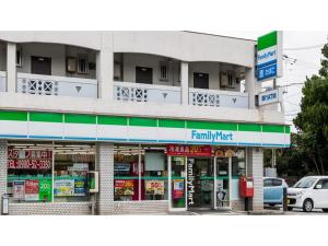 a building with a family wait sign in front of it at Hotel Thomas Nago - Vacation STAY 40485v in Nago
