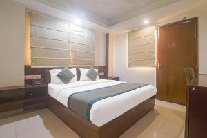 Postel nebo postele na pokoji v ubytování Hotel Sizzling Starr