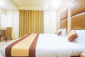 Postel nebo postele na pokoji v ubytování Hotel Sizzling Starr
