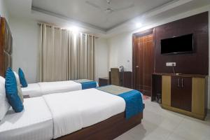 Postel nebo postele na pokoji v ubytování Hotel Sizzling Starr