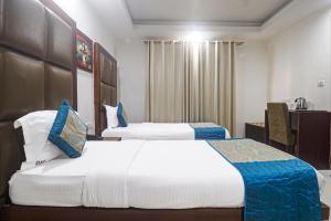 Postel nebo postele na pokoji v ubytování Hotel Sizzling Starr