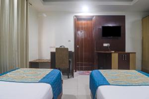Postel nebo postele na pokoji v ubytování Hotel Sizzling Starr