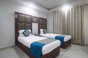 Postel nebo postele na pokoji v ubytování Hotel Sizzling Starr