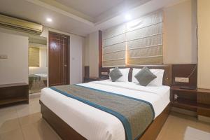 Postel nebo postele na pokoji v ubytování Hotel Sizzling Starr