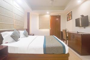 Postel nebo postele na pokoji v ubytování Hotel Sizzling Starr