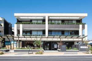 a building with plants on the top of it at Oceano Residence Mornington in Mornington