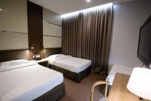 Postel nebo postele na pokoji v ubytování Hotel Meliden
