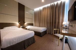 Postel nebo postele na pokoji v ubytování Hotel Meliden
