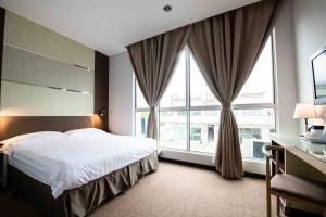 Postel nebo postele na pokoji v ubytování Hotel Meliden
