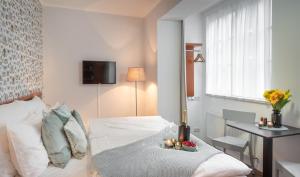 Postel nebo postele na pokoji v ubytování 4 Elements Apartments