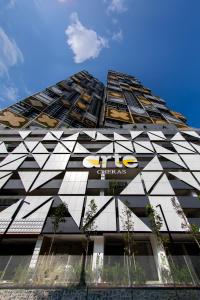 a tall building with a chrysler sign on it at Arte Cheras Designer Suite by Moka @ Cheras in Kuala Lumpur