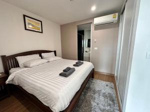 Ένα ή περισσότερα κρεβάτια σε δωμάτιο στο 1Bedroom+Sofa bed, Luxury Condo@Nimmana +19 φωτογραφίες