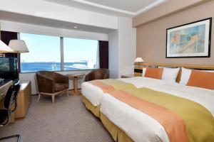TV a/nebo společenská místnost v ubytování Hotel New Grand