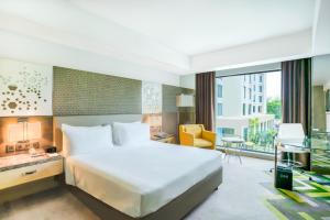 A bed or beds in a room at Courtyard by Marriott Agra