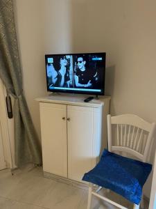TV a/nebo společenská místnost v ubytování casa Ricciulella